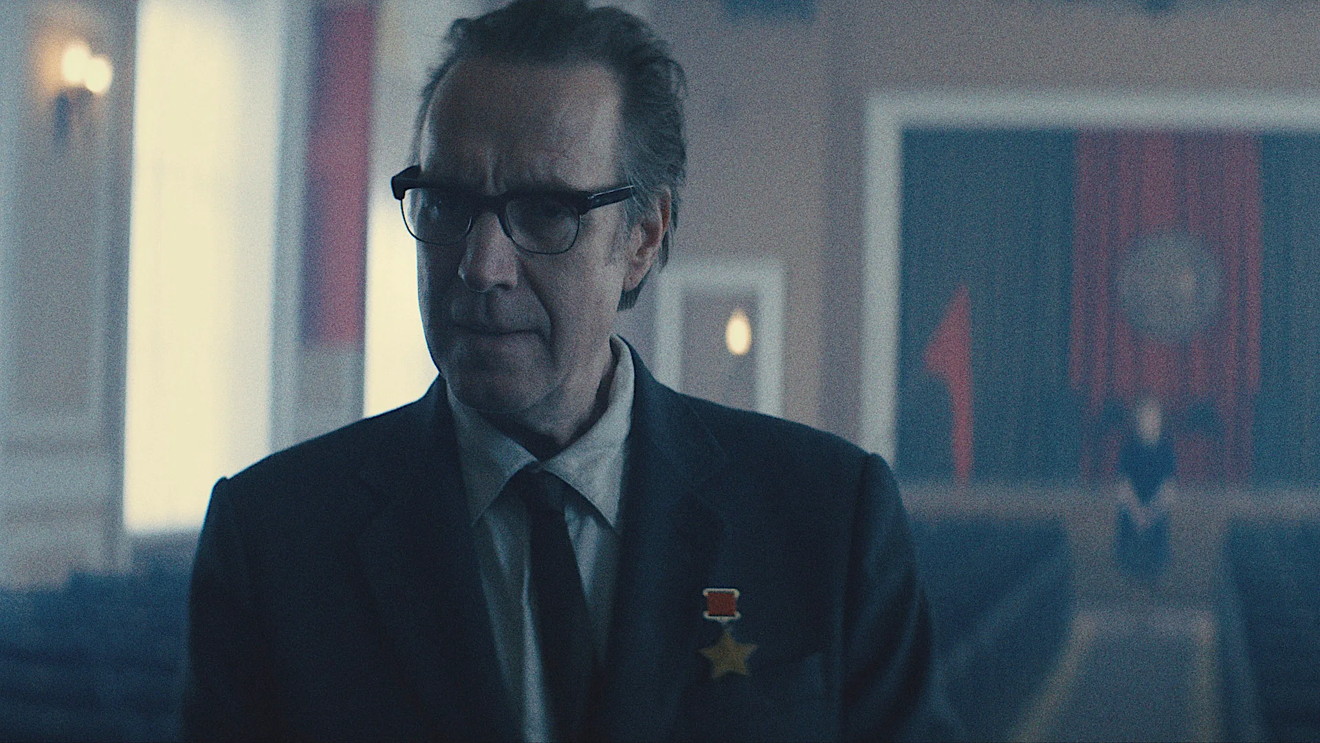 Star City on Apple TV+: The Best New Sci-Fi Thriller Explained Star City Apple TV+ — a man in spectacles wearing a suit and tie