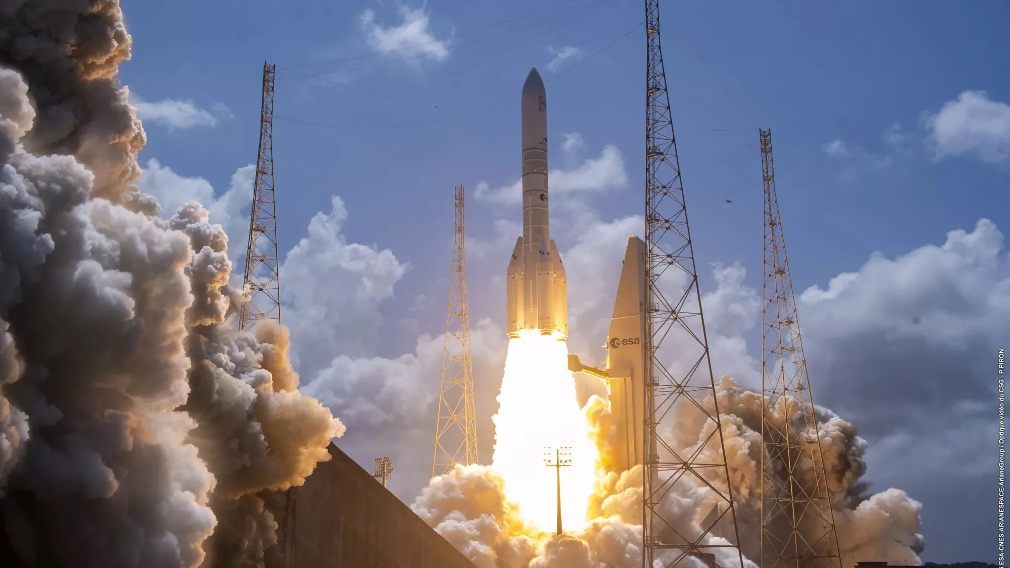Ariane 6 Rocket Sets New Record With 36 Amazon Leo Satellites Ariane 6 launch — a big white rocket launches into a blue sky, creating a huge plume of grayish-white exhaust