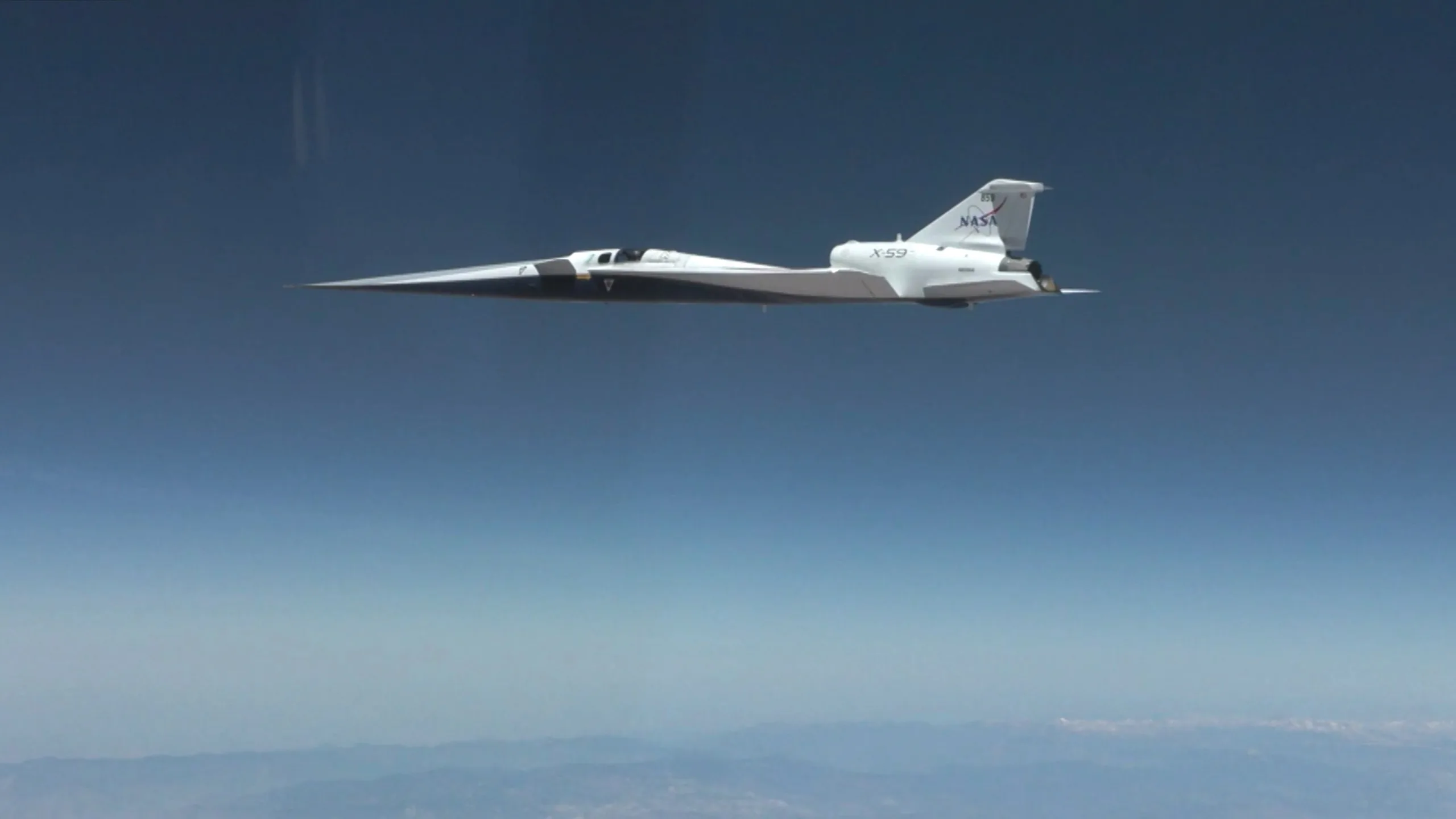 NASA's X-59 Hits Mach 1.1 in First Supersonic Flight NASA X-59 supersonic flight — a pointy-nosed jet flies through blue skies