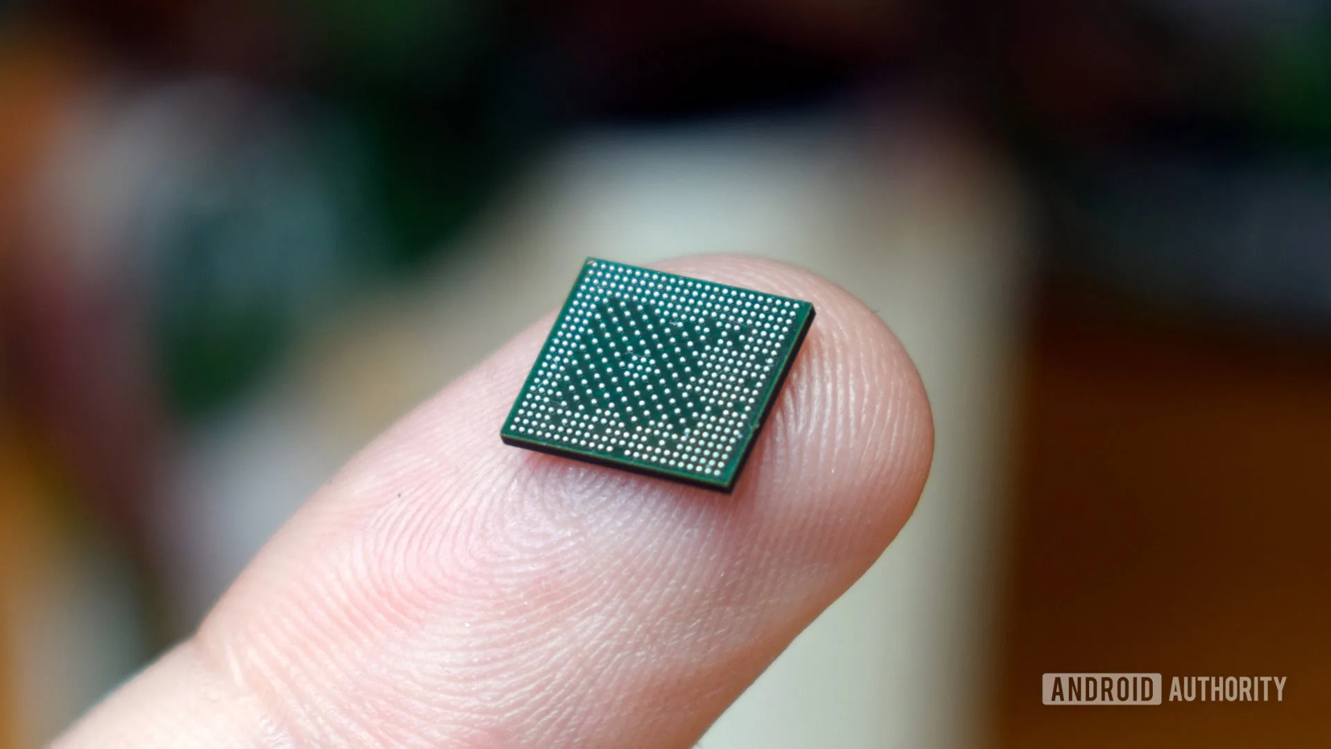 Smartphone Prices Are Rising — Apple May Give Android Cover to Follow smartphone prices rising — SoC chipset processor on finger