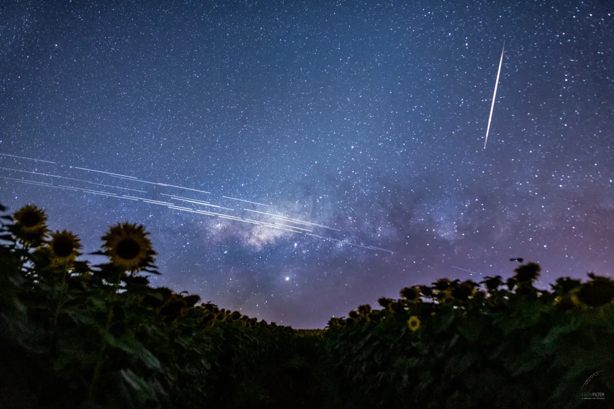 NGSO Satellite Alliance Launches — SpaceX Sits It Out A composite image of 33 exposures captures reflective Starlink satellites, making them appear to streak over the sky of