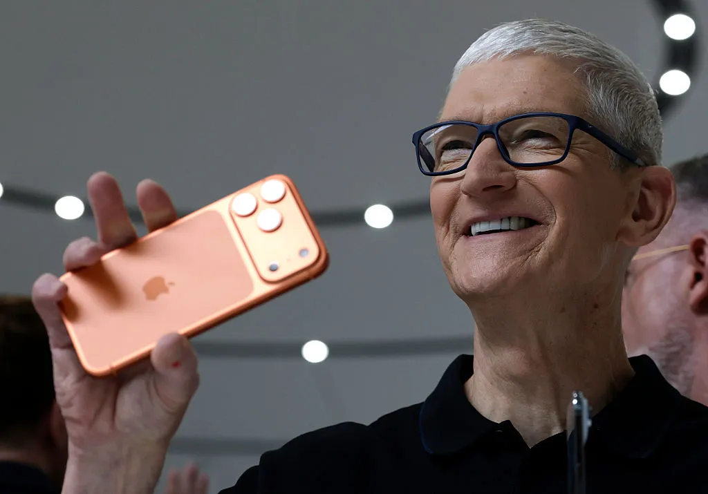 iOS 27 AI Features: 6 Powerful Upgrades Beyond Siri iOS 27 AI features — Apple CEO Tim Cook holds up a new iPhone 17 Pro