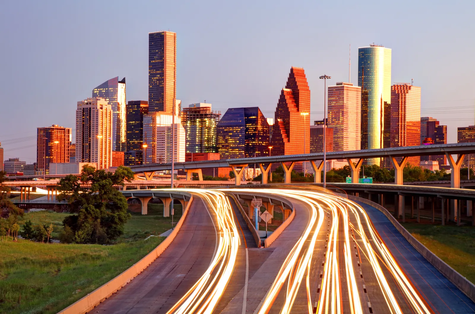 Houston Business Travel Guide: Best Hotels, Workspaces & Food in 2026 Image may contain Road Freeway City Architecture Building Cityscape Urban Metropolis Overpass Tower and Downtown