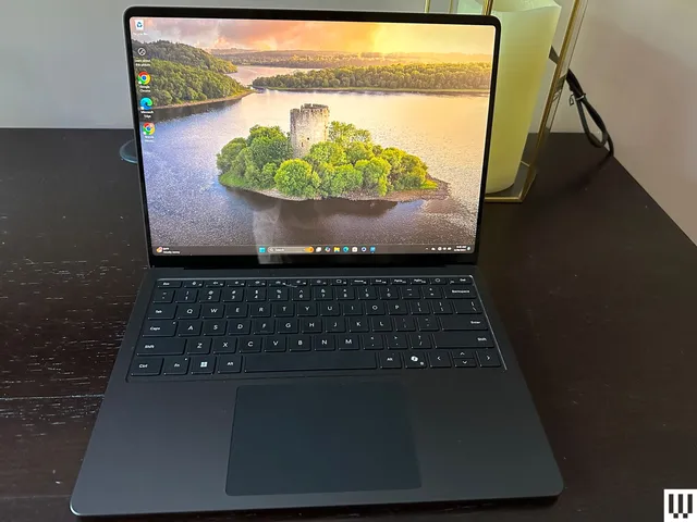 Best Prime Day Deals 2026: Top Early Picks Worth Buying Now Prime Day deals 2026 — Front view of a laptop sitting on a wooden desk with the image of an island on the screen