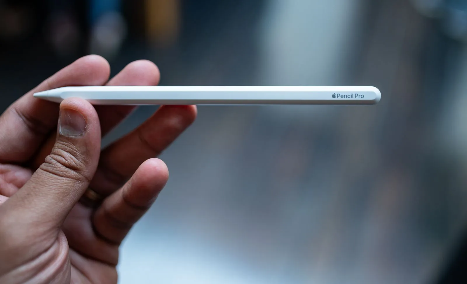 Best iPad to Buy in 2026: The Complete Model Guide Person holding the Apple Pencil Pro