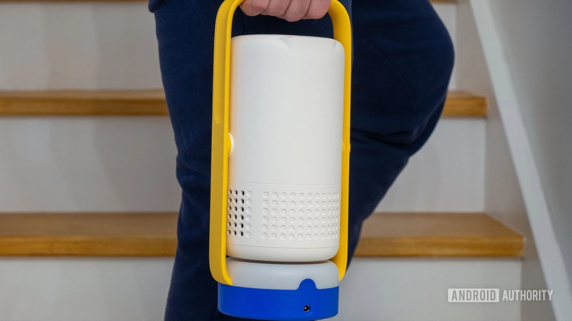 Google TV Projector Review: Why I'd Skip My Next TV Purchase xgimi vibe one projector carried in hand