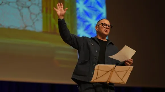 Zuckerberg's $111M War on Sarah Wynn-Williams, Explained A photo of me onstage, giving a speech, pounding the podium.