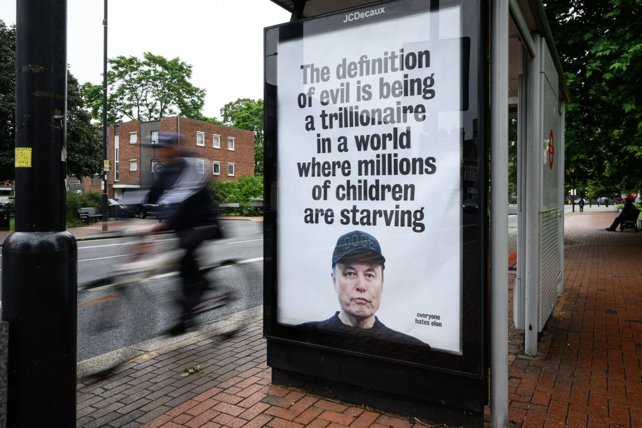 Sundar Pichai Faces Stanford Walkout Over Project Nimbus An unofficially-installed poster critical of Elon Musk's wealth is displayed on a bus shelter on June 11, 2026 in T