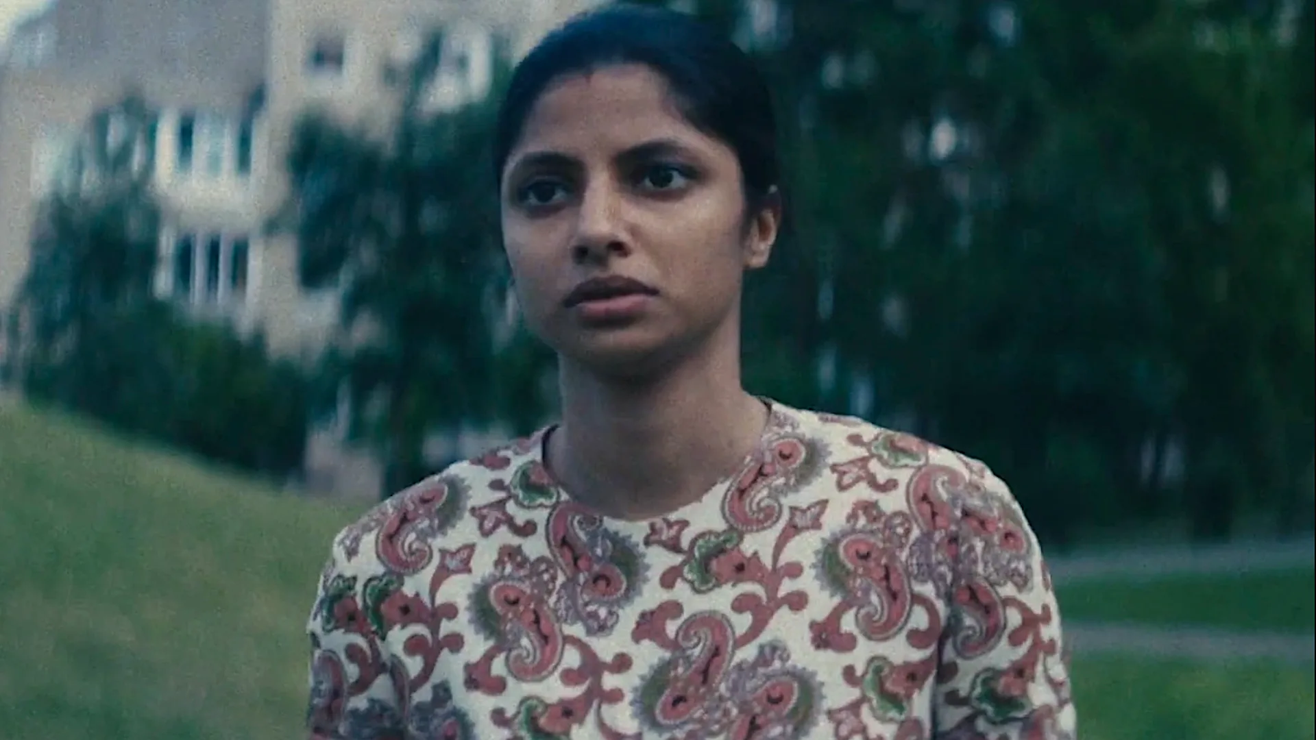 Star City Cast on Playing the Brutal Soviet Space Era a young woman in a patterned dress on a lawn
