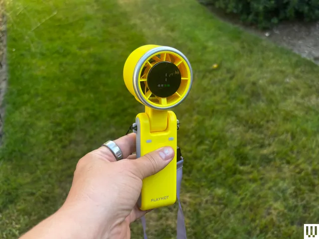 Best Handheld Fans of 2026: Top Picks Tested and Ranked Image may contain Photography Grass Plant Machine Wheel Baby Person Electronics and Camera