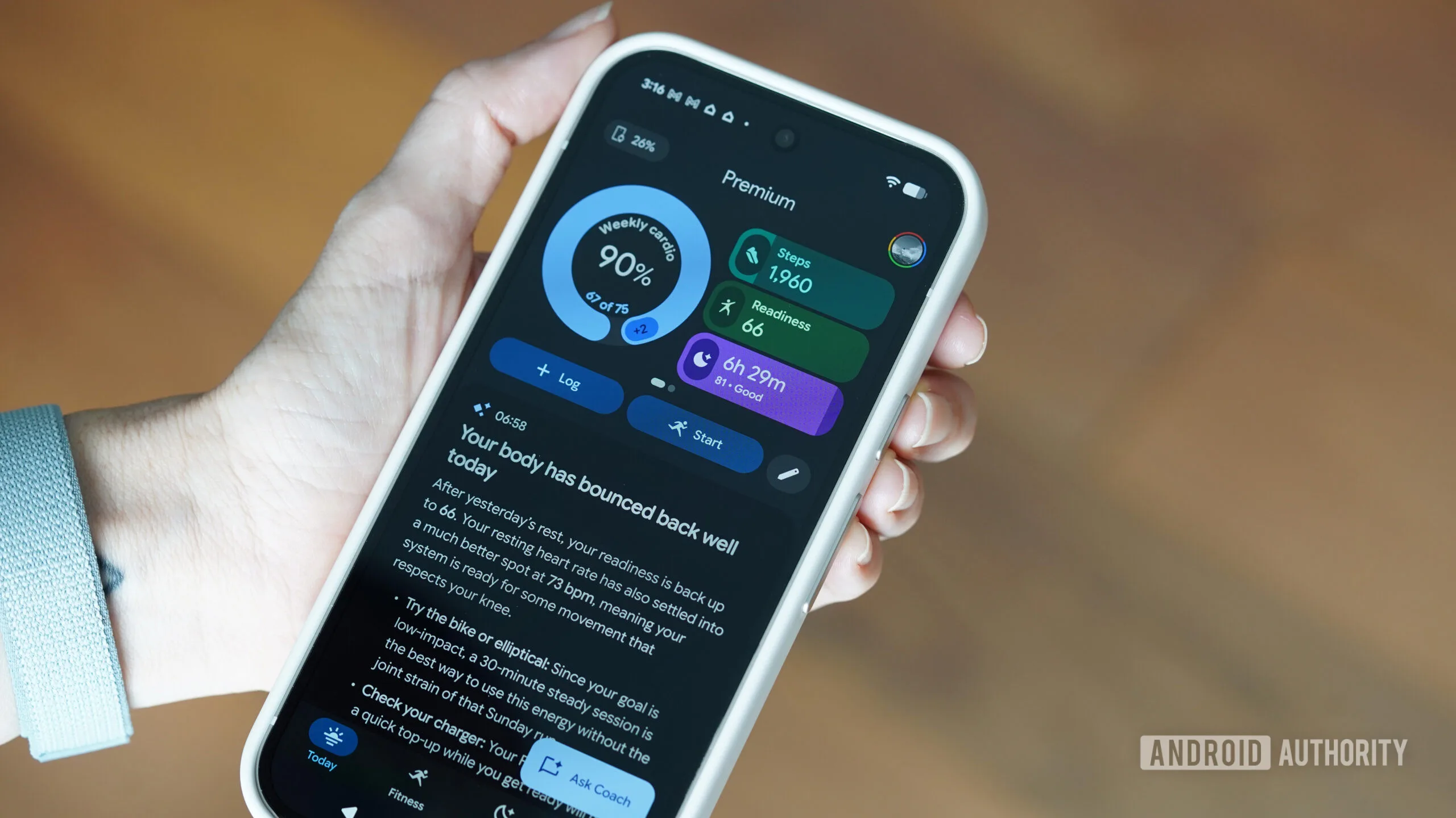 Google Health 5.02: New Nap Tracking, Key Metrics & Data Controls Google Health update 2026 — A Fitbit air user checks their stats on the Google Health app.