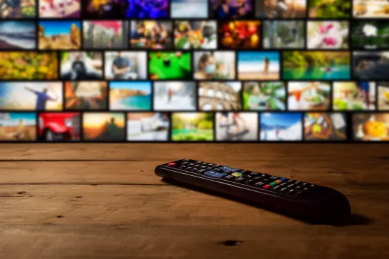 Streaming Ads Must Match Volume: California's New Law Explained streaming ads volume — Smart tv interactive television with remote control on the table