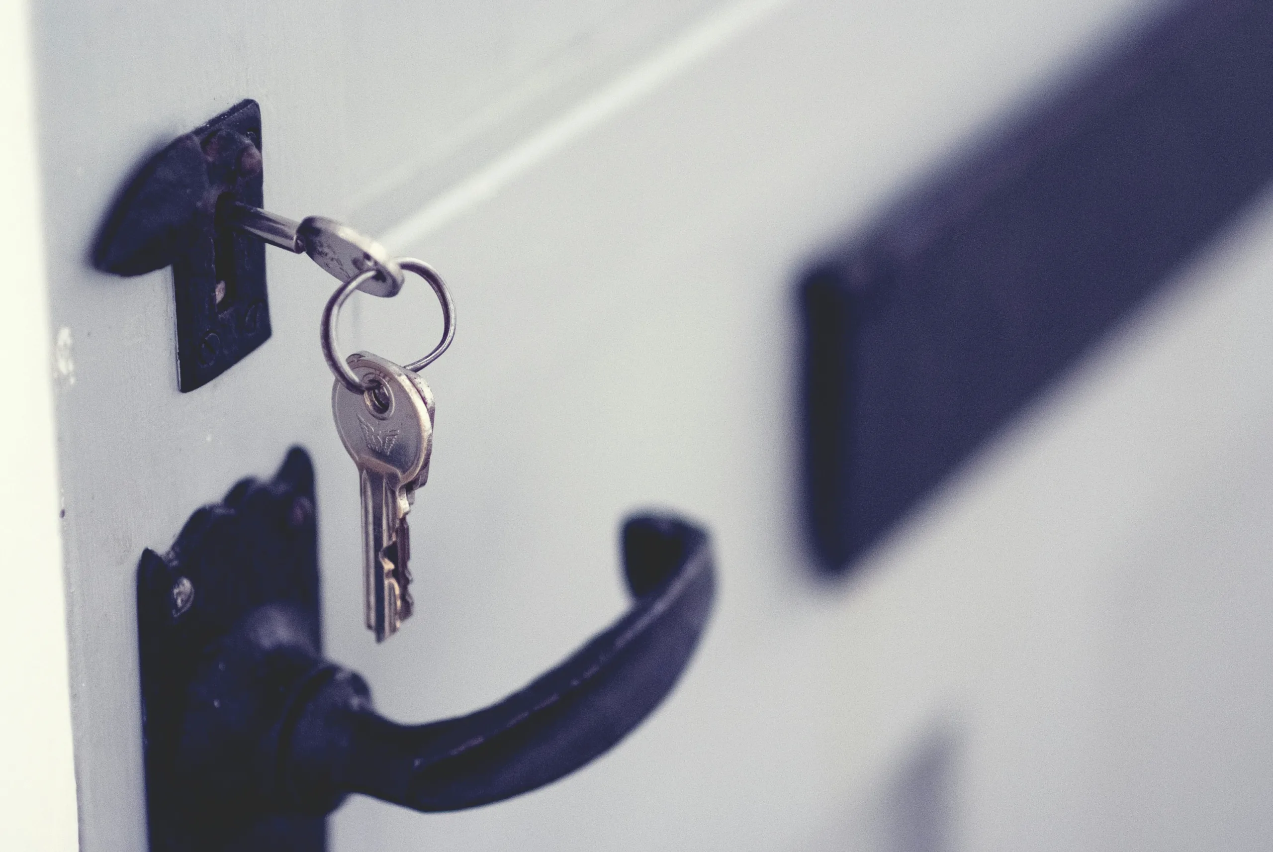Meta's AI Chatbot Hack: 20,000 Instagram Accounts Compromised a photo of a set of keys left in a door lock, a visualization of a security vulnerability.