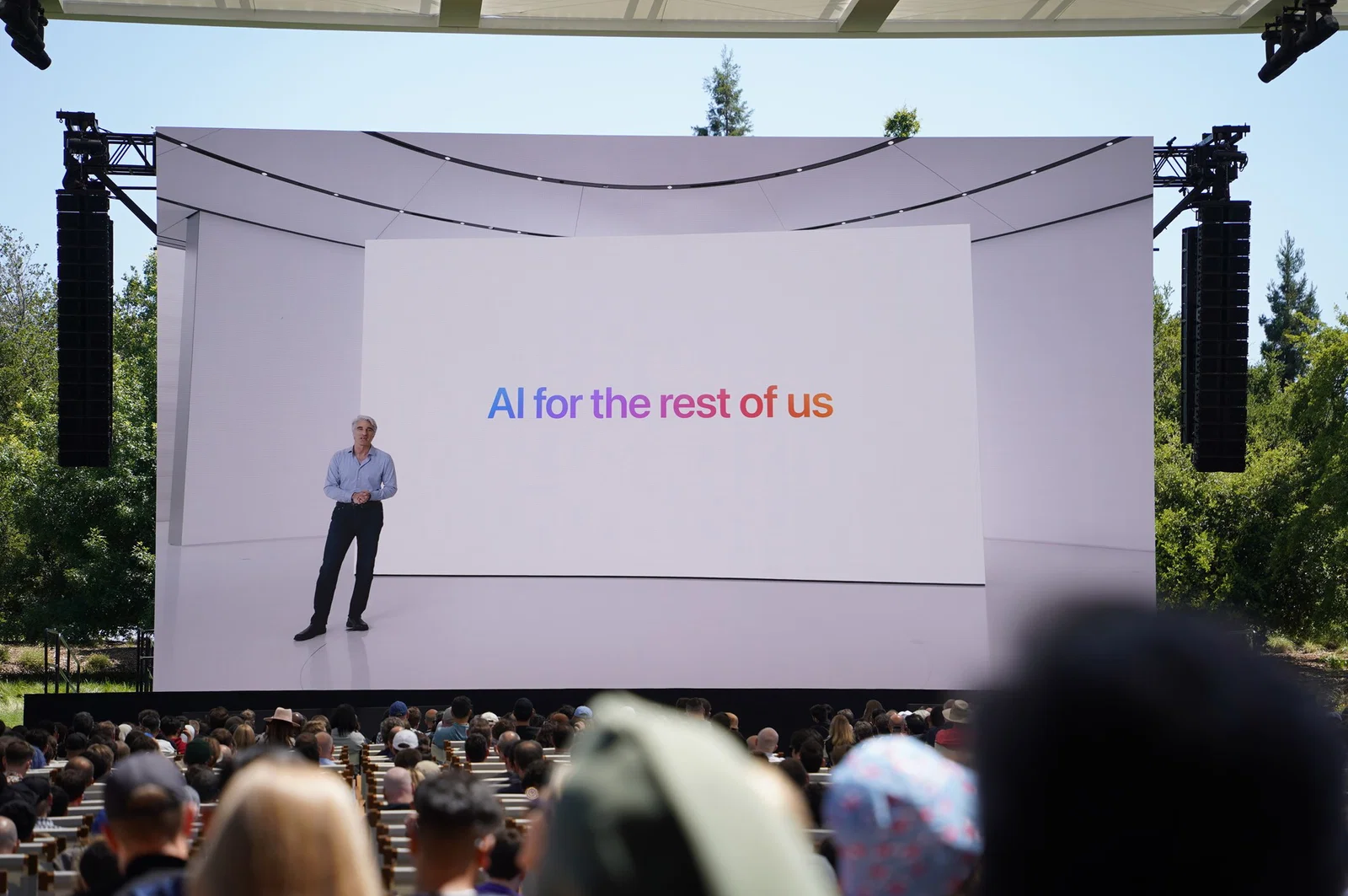 New Siri Gets a Gemini Engine — But Can Apple Finally Deliver? new Siri — Photo from 2024 WWDC keynote featuring a tagline that reads “AI for the rest of us”
