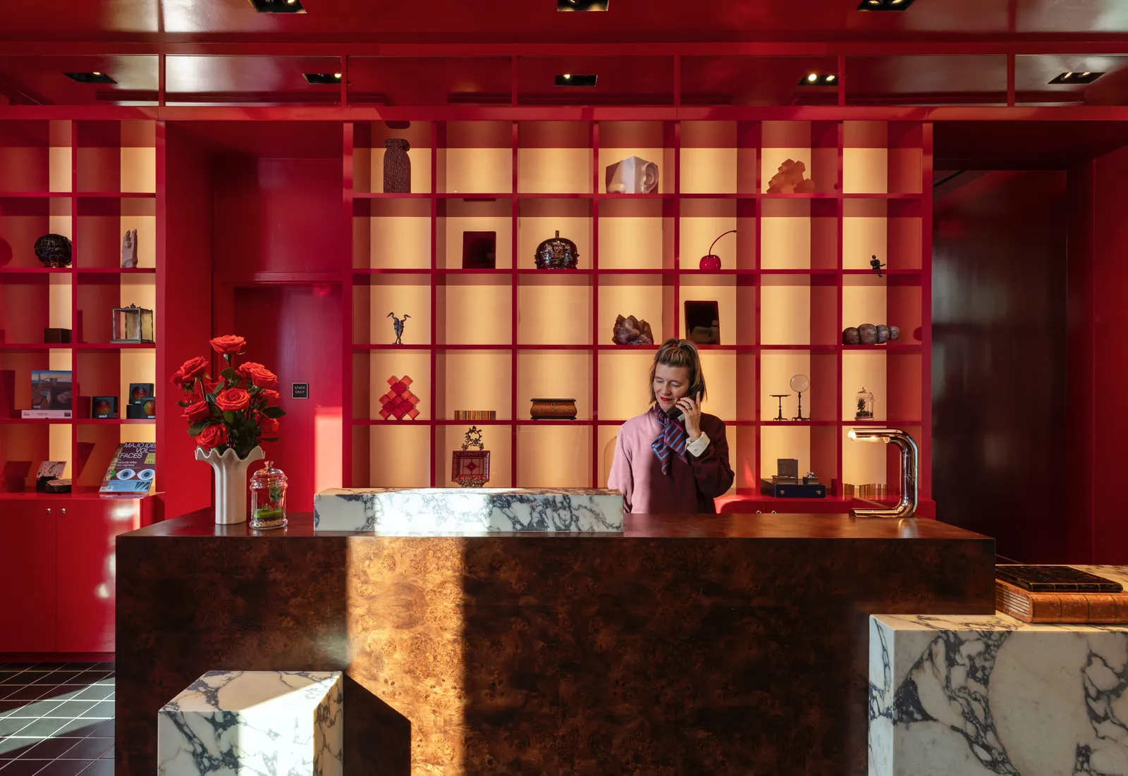 Houston Business Travel Guide: Best Hotels, Workspaces & Food in 2026 Image may contain Furniture Table Reception Adult Person Indoors Interior Design Desk Lighting Shop Face and Head