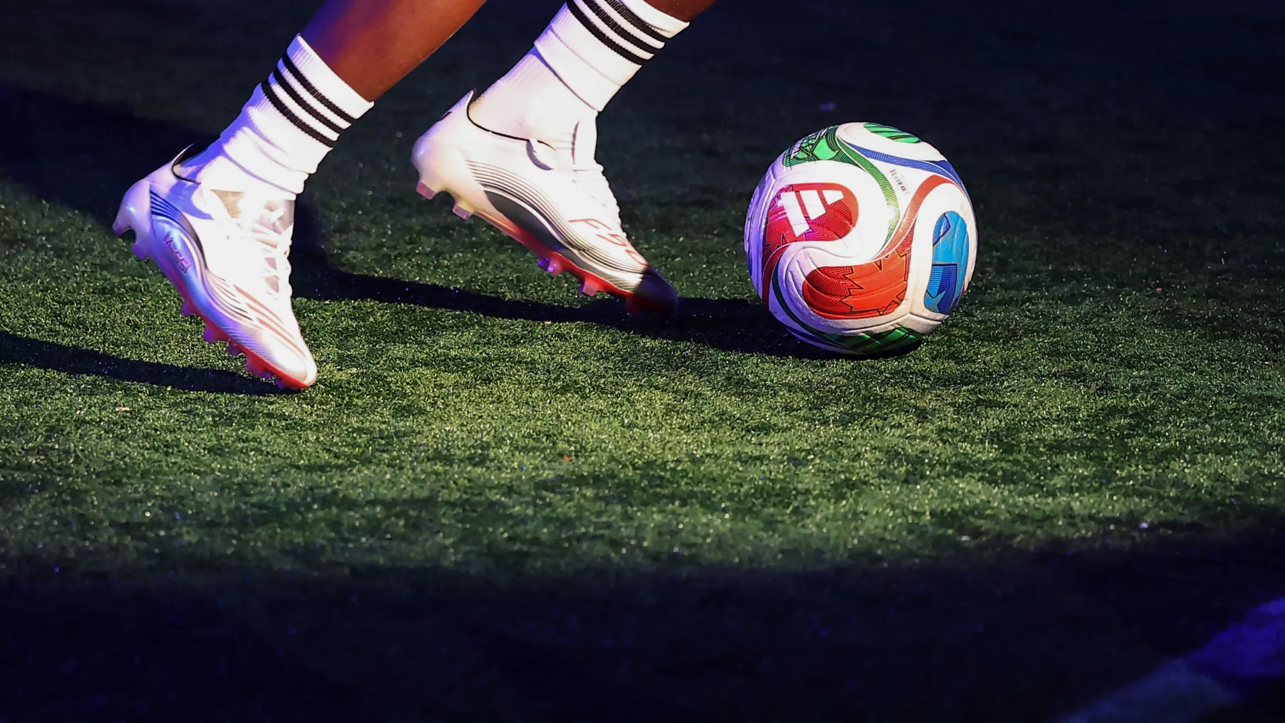 World Cup Ball 2026: Why the Trionda May Cut Long Kicks Short close-up of a person in cleats about to kick the Trionda FIFA match ball