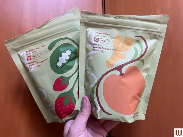 Best Greens Powders 2026: Top 16 Picks, Expert-Tested A hand holding up two packets of Groove Greens Powder one flavor as strawberry kiwi and the other as ginger peach