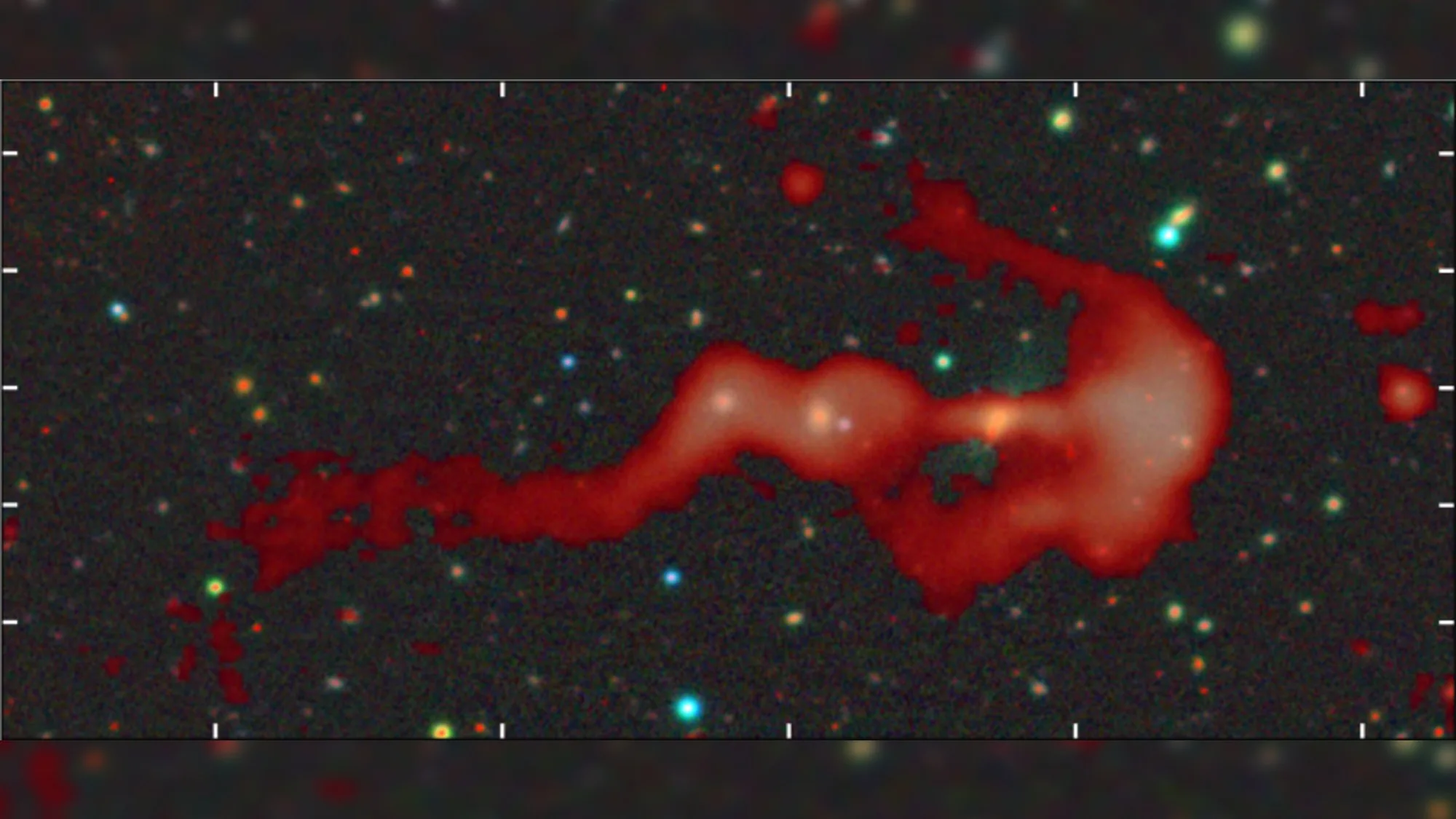 RAD-BAARG: New Cosmic Shock Wave Discovery Explained cosmic shock wave — a red wisp of gas on a starry background