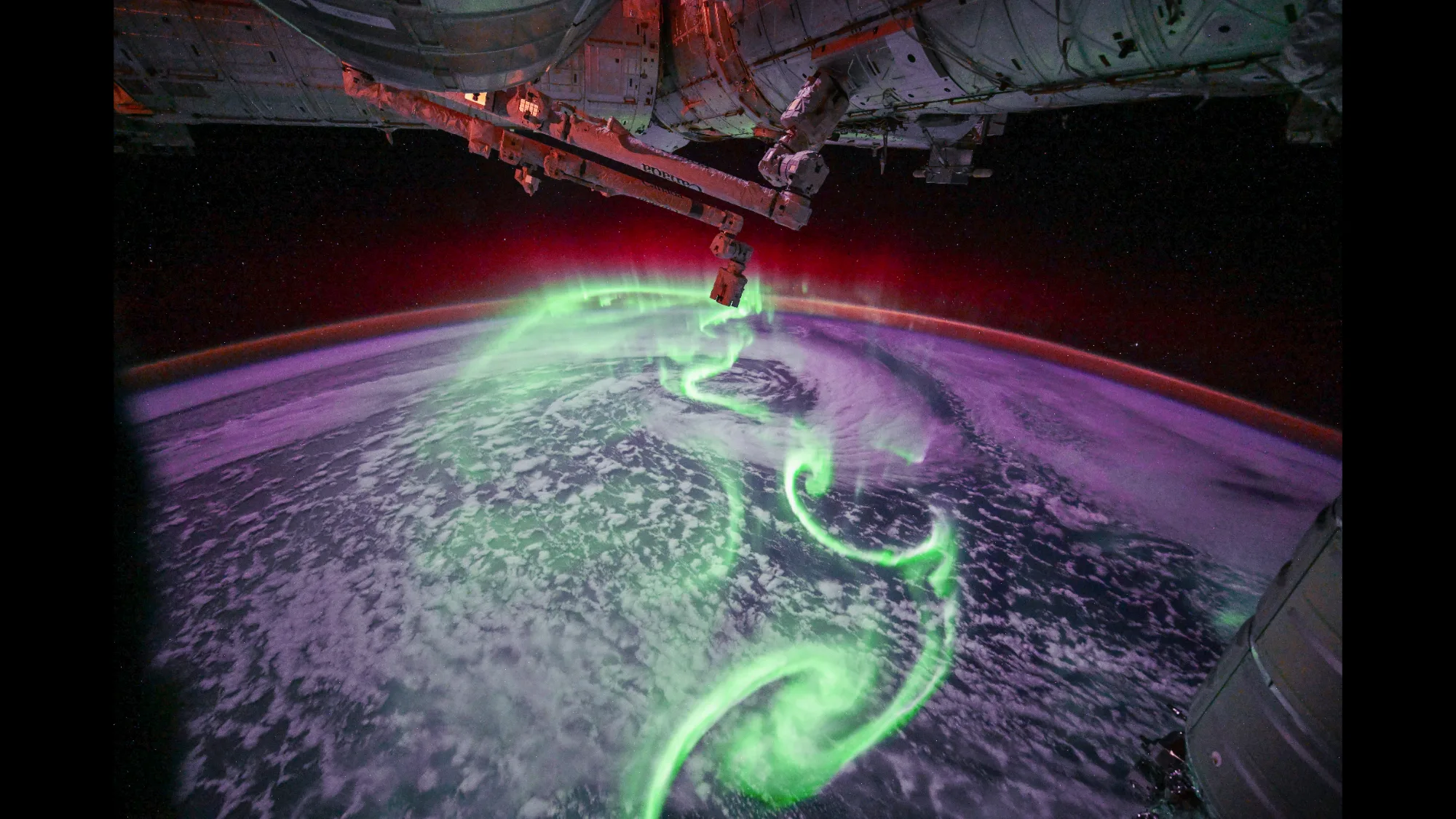 Aurora Australis From Space: ESA Astronaut Captures Powerful New Image aurora australis from space — Neon green, purple, and red auroras over Earth.