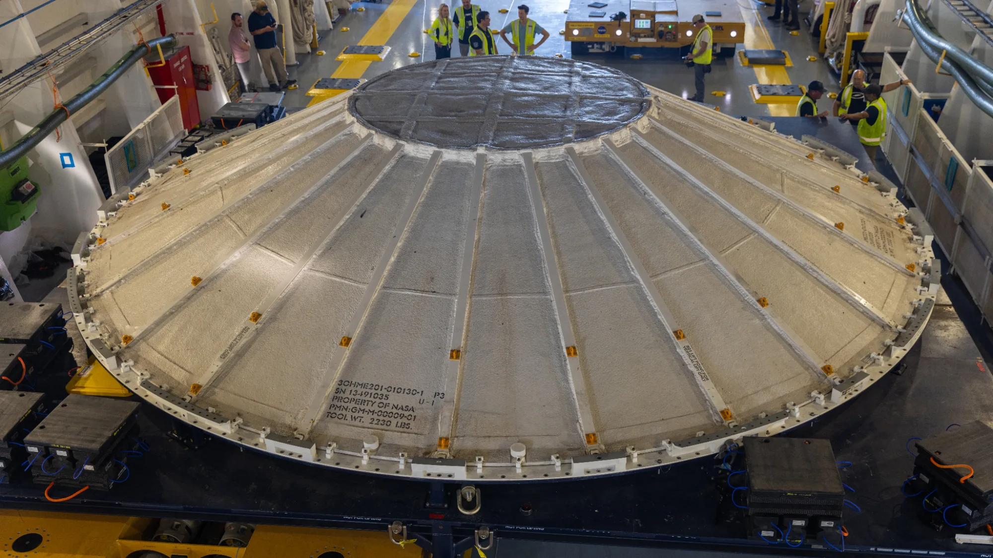 NASA's Artemis 3 Rocket Gets a UFO-Shaped Weather Cover Artemis 3 moon mission — A flying saucer-shaped weather cover for the Artemis 3 SLS core stage.
