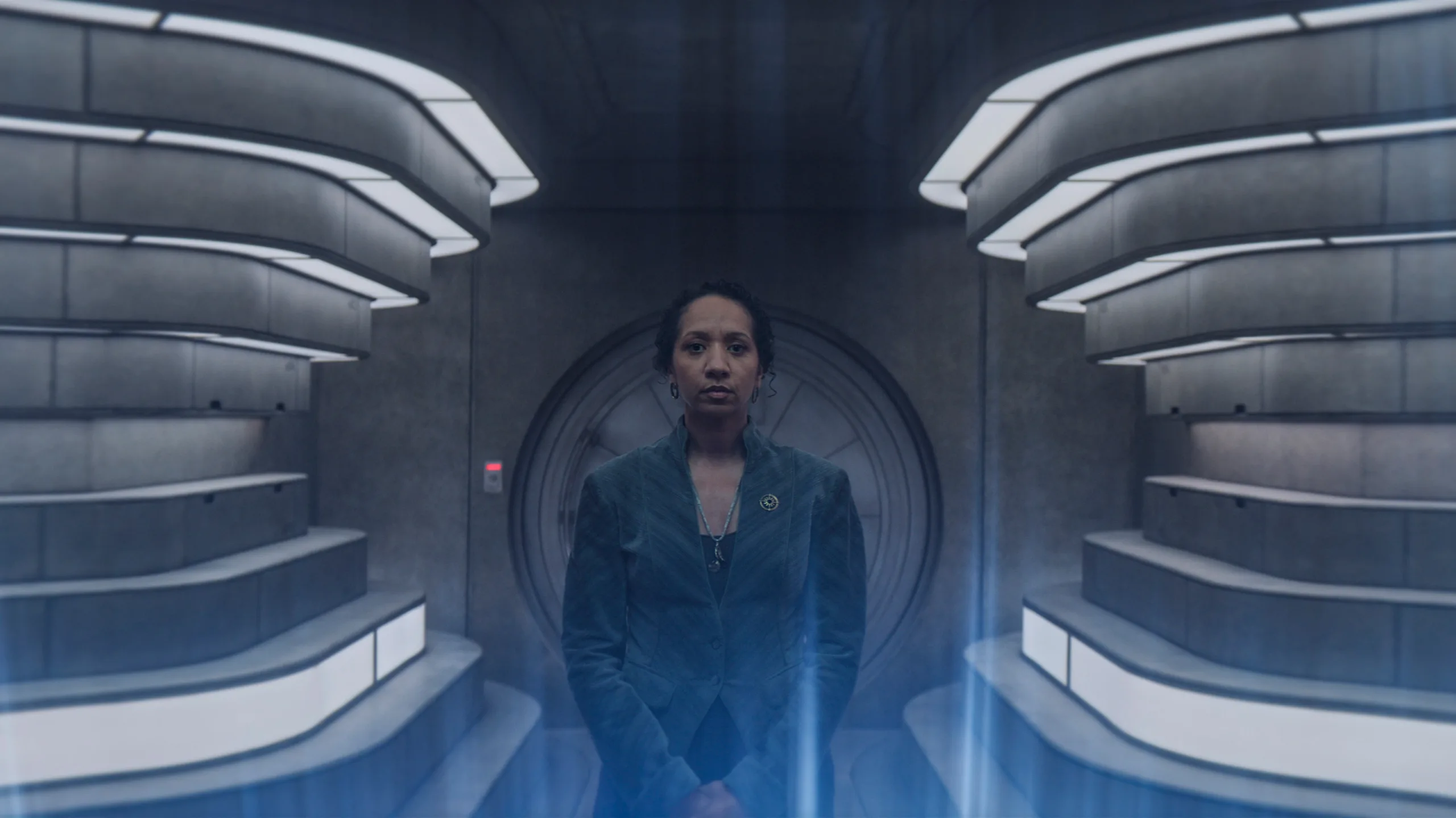 Silo Season 3: Complete Guide to the New Apple TV+ Thriller a woman stands in a computer room with illuminated walls