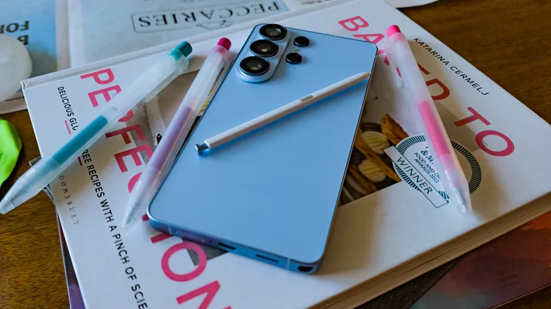Galaxy Z Fold 8 vs S26 Ultra: Samsung’s Ultimate Trade-Off Samsung Galaxy S26 Ultra posed on table with books and pens