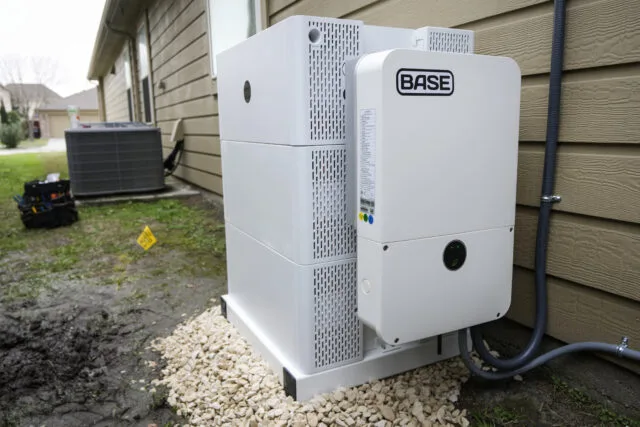Home Battery Installations Hit Record 673 MW in Early 2026 home battery installations — A white-colored residential battery with the name "BASE" on the side sits on the