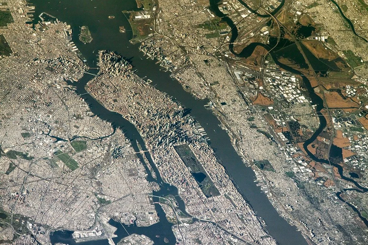 NASA's ISS Photos Reveal 2026 World Cup Stadiums From 250 Miles Up An aerial view shows the New York New Jersey Stadium and surrounding Meadowlands on the right, with the dense urban land