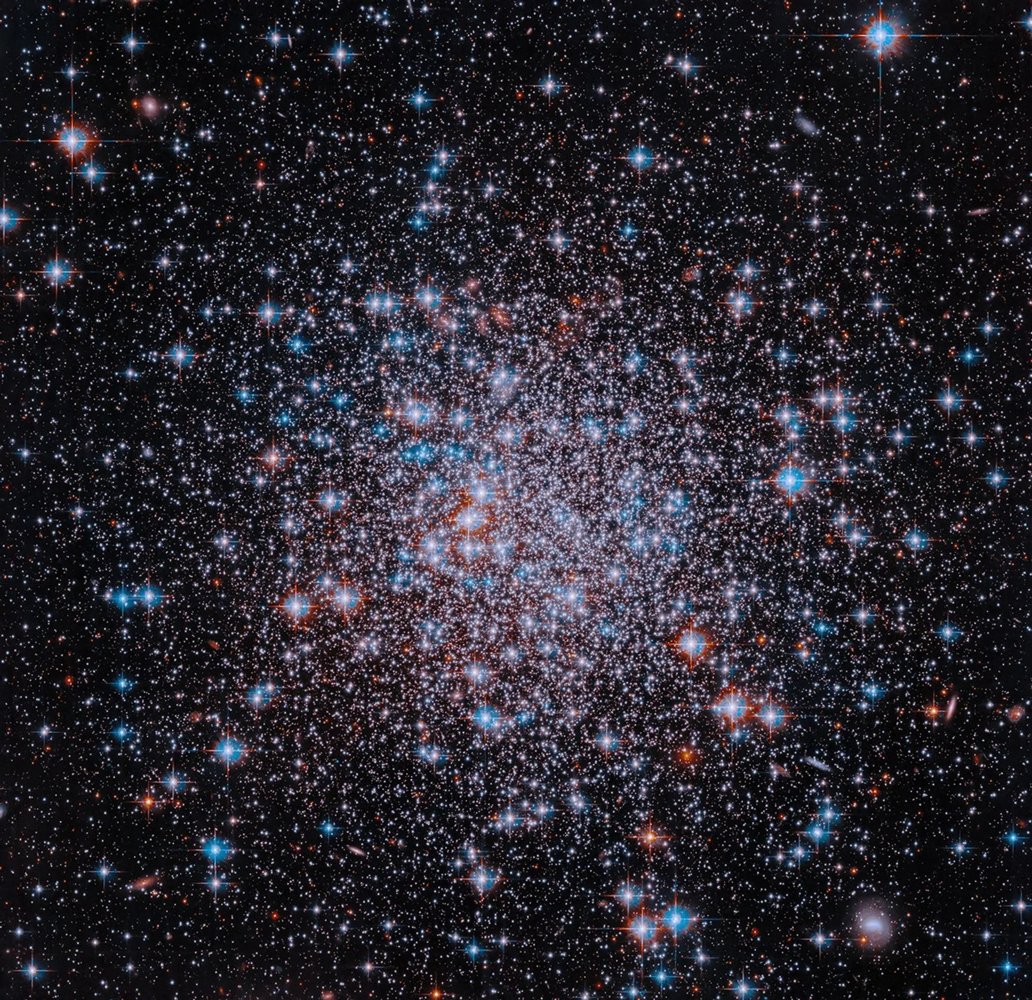 Hubble Captures a 13-Billion-Year-Old Star Cluster in New NASA Image Hubble Space Telescope 2026 — Hubble image of NGC 6426, a compact grouping of a multitude of stars shine in red, white a