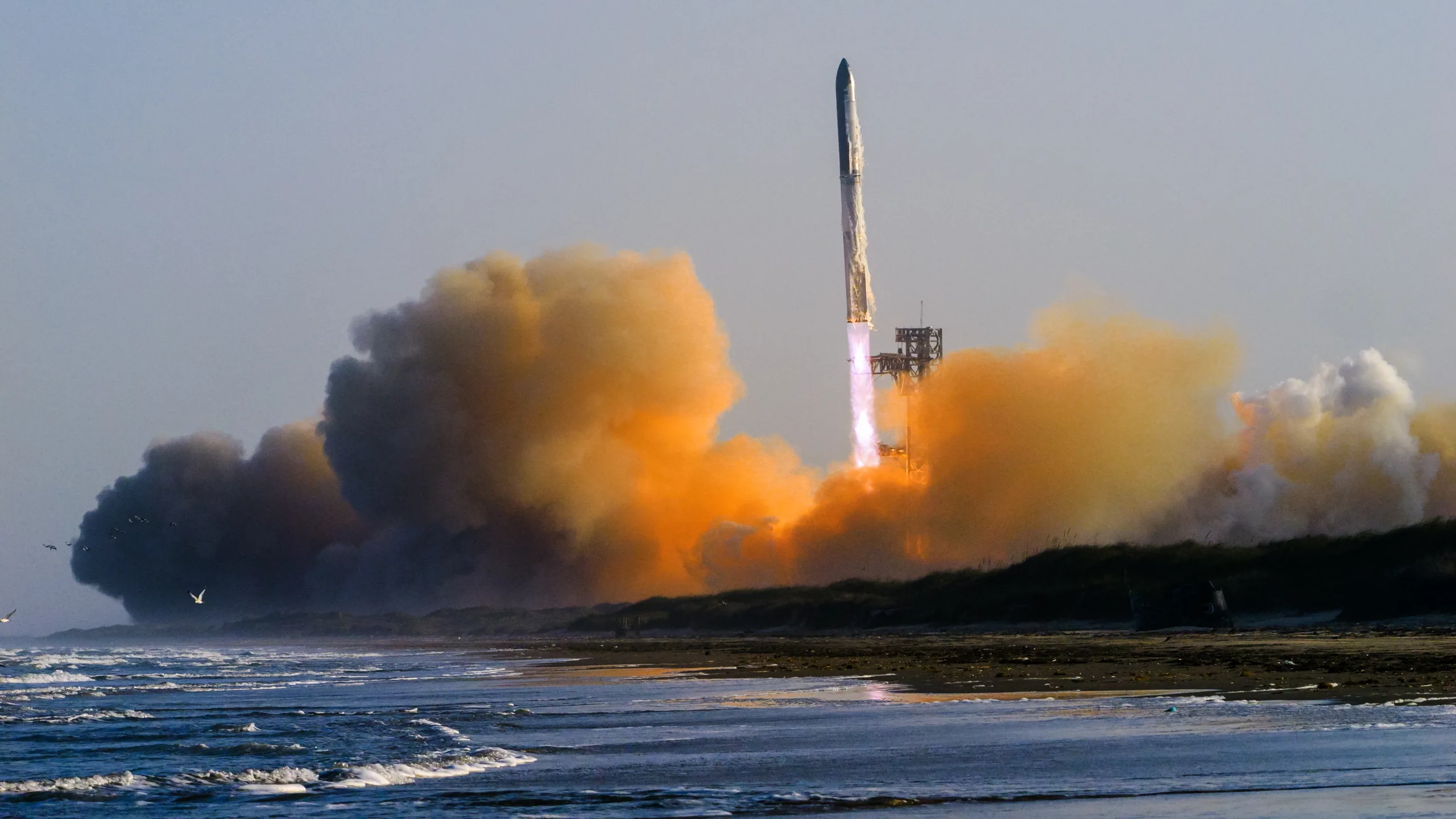Starship Launch Capacity Is Forcing Satellite Makers to Rethink Everyt Starship launch capacity — A Starship rocket and Super Heavy booster lift off from Starbase, Texas