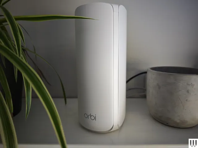 Best Wi-Fi Routers 2026: Top 7 Picks After Testing 40+ Image may contain Pottery Cookware Pot Plant Potted Plant Electronics Hardware Modem and Jar
