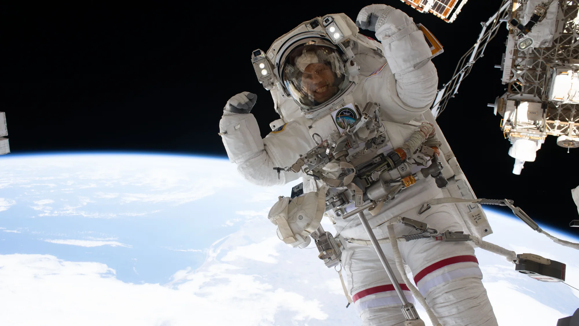 NASA Spacewalk: Chris Williams Flexes 250 Miles Up NASA spacewalk — NASA astronaut Chris Williams flexes his muscles while on a spacewalk.