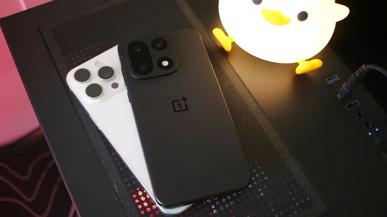 Switching From iPhone Has 5 Essential Trade-Offs A OnePlus 15 sitting on top of an iPhone 15 Pro Max