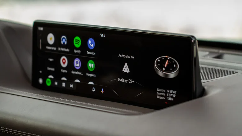 Android Auto vs CarPlay: The Key Differences for Drivers The Android Auto interface on a car screen