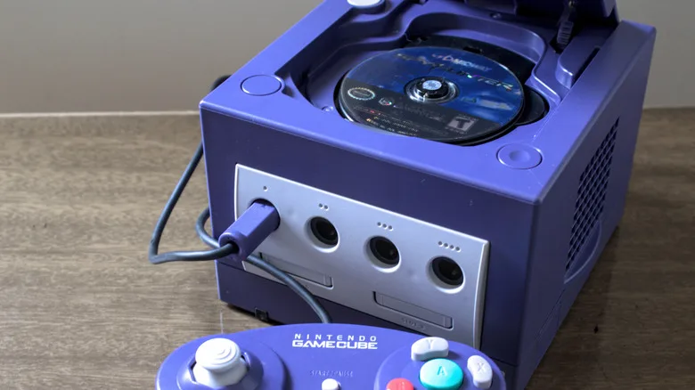 GameCube Mini Discs Explained: Nintendo’s Key Trade-Off GameCube mini discs — A GameCube with its disc drive open