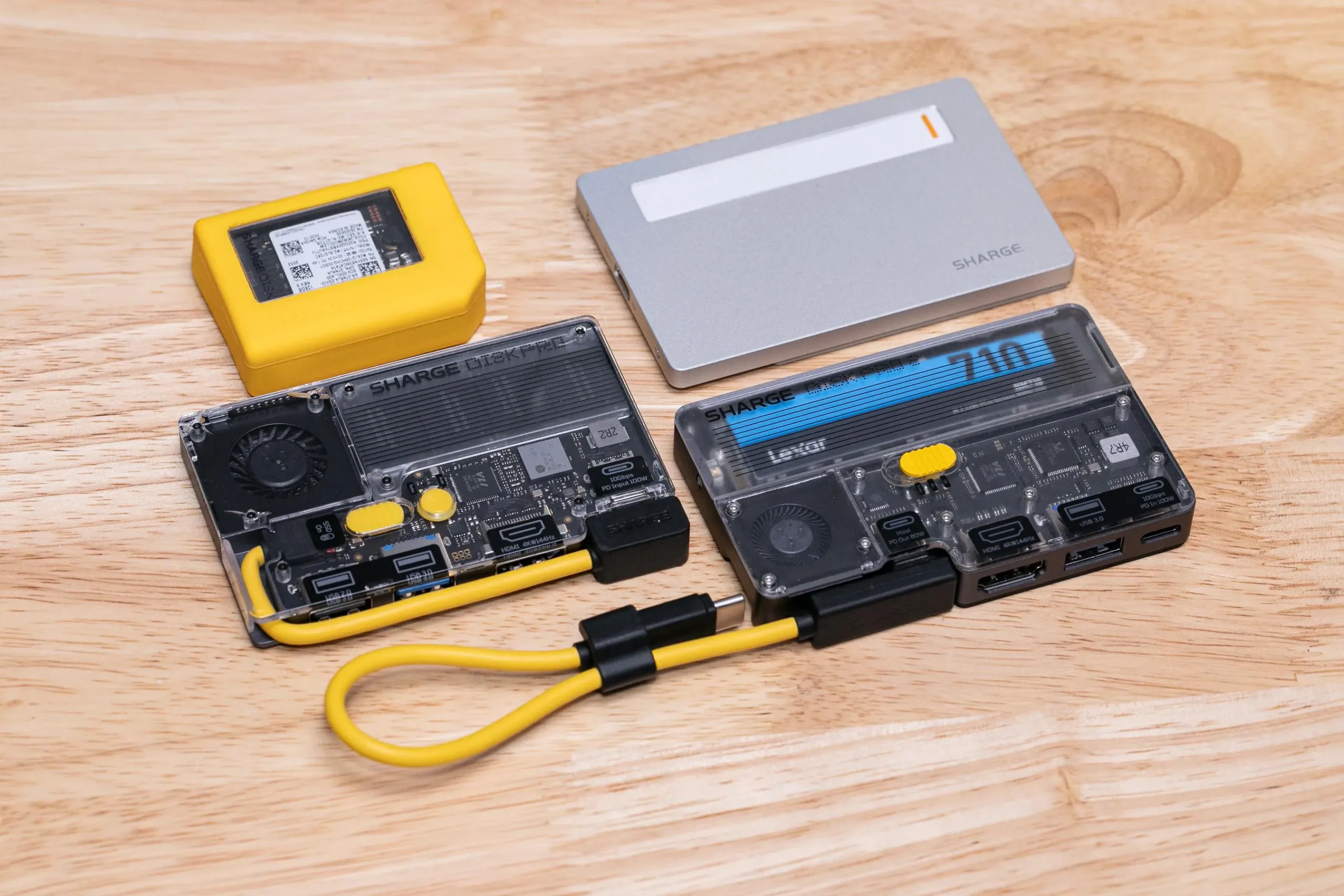 Sharge Disk Pro 2 turns an SSD into a serious travel dock Sharge Disk Pro 2 — Sharge Disk (yellow), Disk Plus (silver), Disk Pro (fixed cable), and Disk Pro 2 (detachable cable).