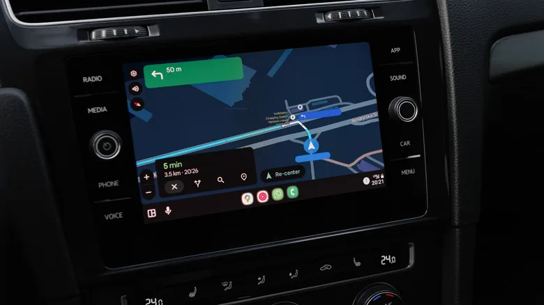 Android Auto vs CarPlay: The Key Differences for Drivers Google Maps route instructions in dark mode on a car screen using Android Auto