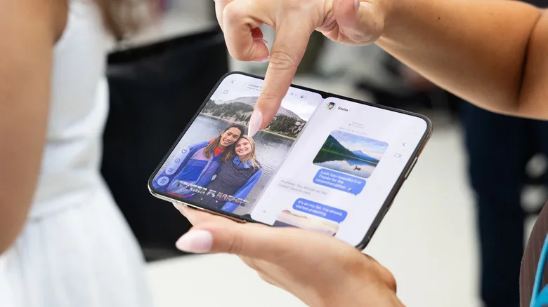 iPhone Duo vs. iPad Mini: The $2,000 Question Finger pointing at an iPhone Duo, showing a camera roll of photo on the left and text messages on the right.